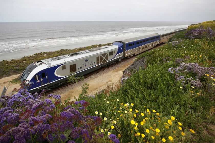 An Amtrak Pacific Surfliner train heads south near 6th Street in Del Mar on May 11, 2020. The latest Del Mar bluff stabilization project has begun on the east side of the tracks in the area.