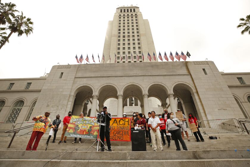 LOS ANGELES, CA - MAY 19: Leonard Averhart known as "Phoenix" speaks from the steps of LA City Hall as members of Unhoused Tenants Against Carceral Housing (UTACH), a newly formed tenant organization, held a news conference to demand "humane treatment in Project Roomkey programs and request (a) meeting with city officials.'' Project Roomkey tenants shared their experiences of "debilitating curfews that prevent them from getting to/from steady employment, confiscation of survival supplies like food and eating utensils, extreme social isolation, harassment from security, complete lack of privacy, no transparency about their future in the program and other punitive rules that further marginalize the poorest Angelenos.'' City Hall on Wednesday, May 19, 2021 in Los Angeles, CA. (Al Seib / Los Angeles Times).