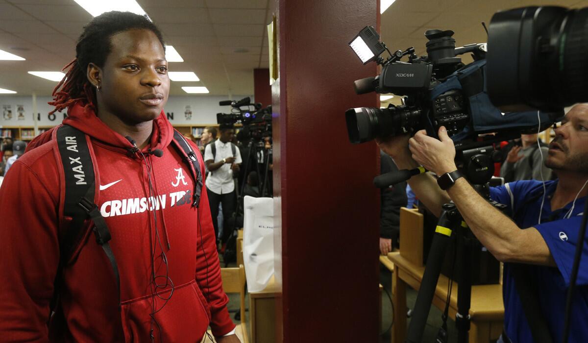 Hillcrest High School running back Brian Robinson wears a University of Alabama sweatshirt as he gets set to speak with the media after committing to the Crimson Tide on national signing day.