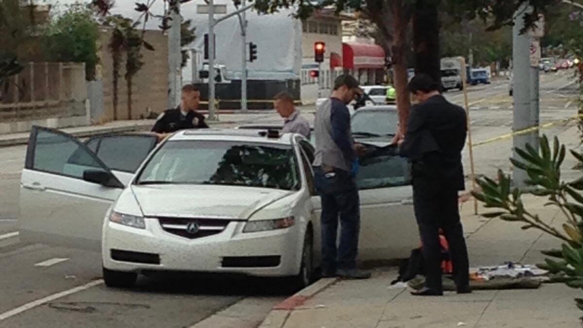 Authorities look over the suspect's car in Santa Monica.
