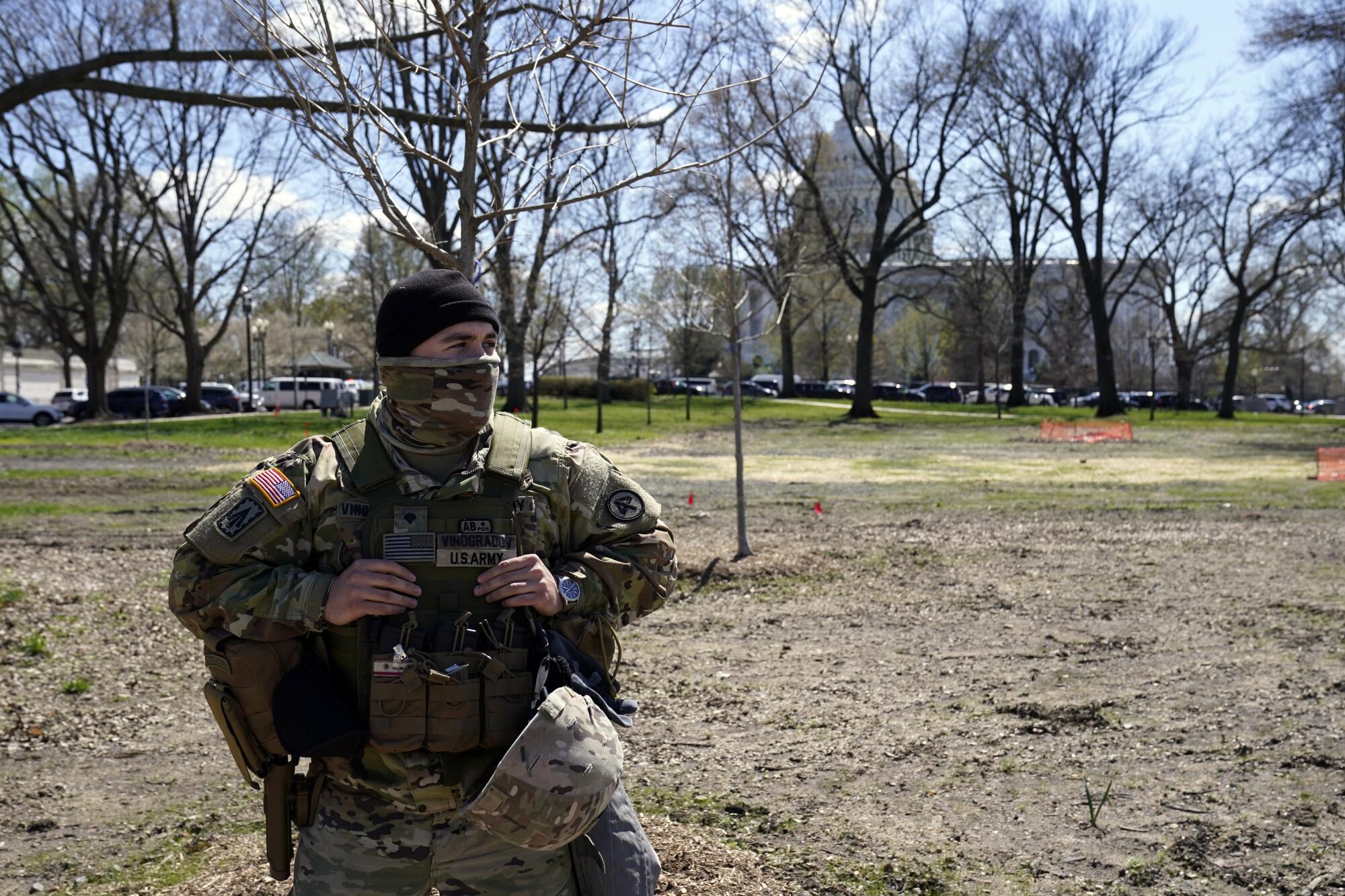 A member of the National Guard patrols near the U.S. Capitol after a car crashed into a barrier on Capitol Hill 