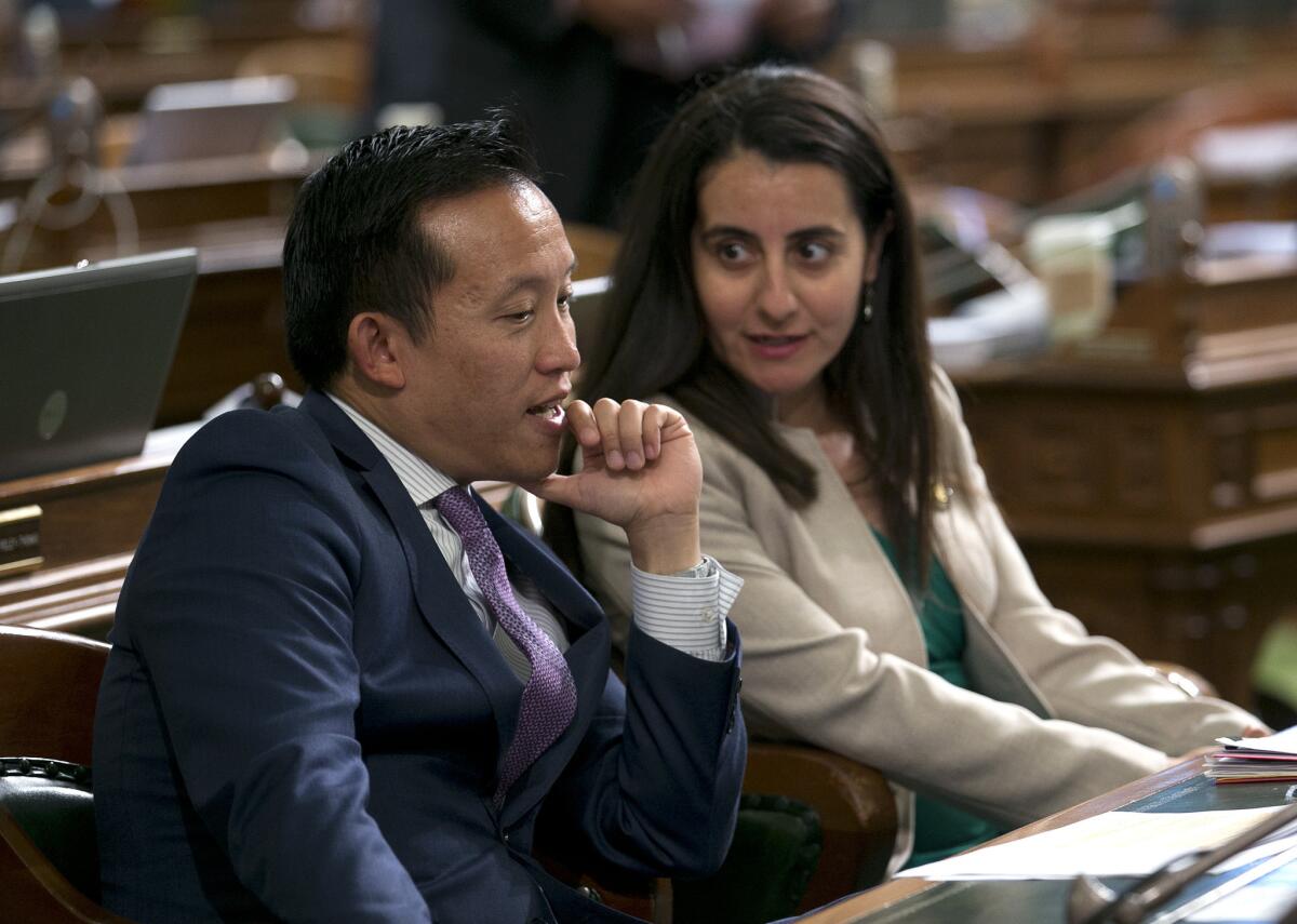 Assemblyman David Chiu (D-San Francisco) talks with Assemblywoman Monique Limon (D-Goleta).