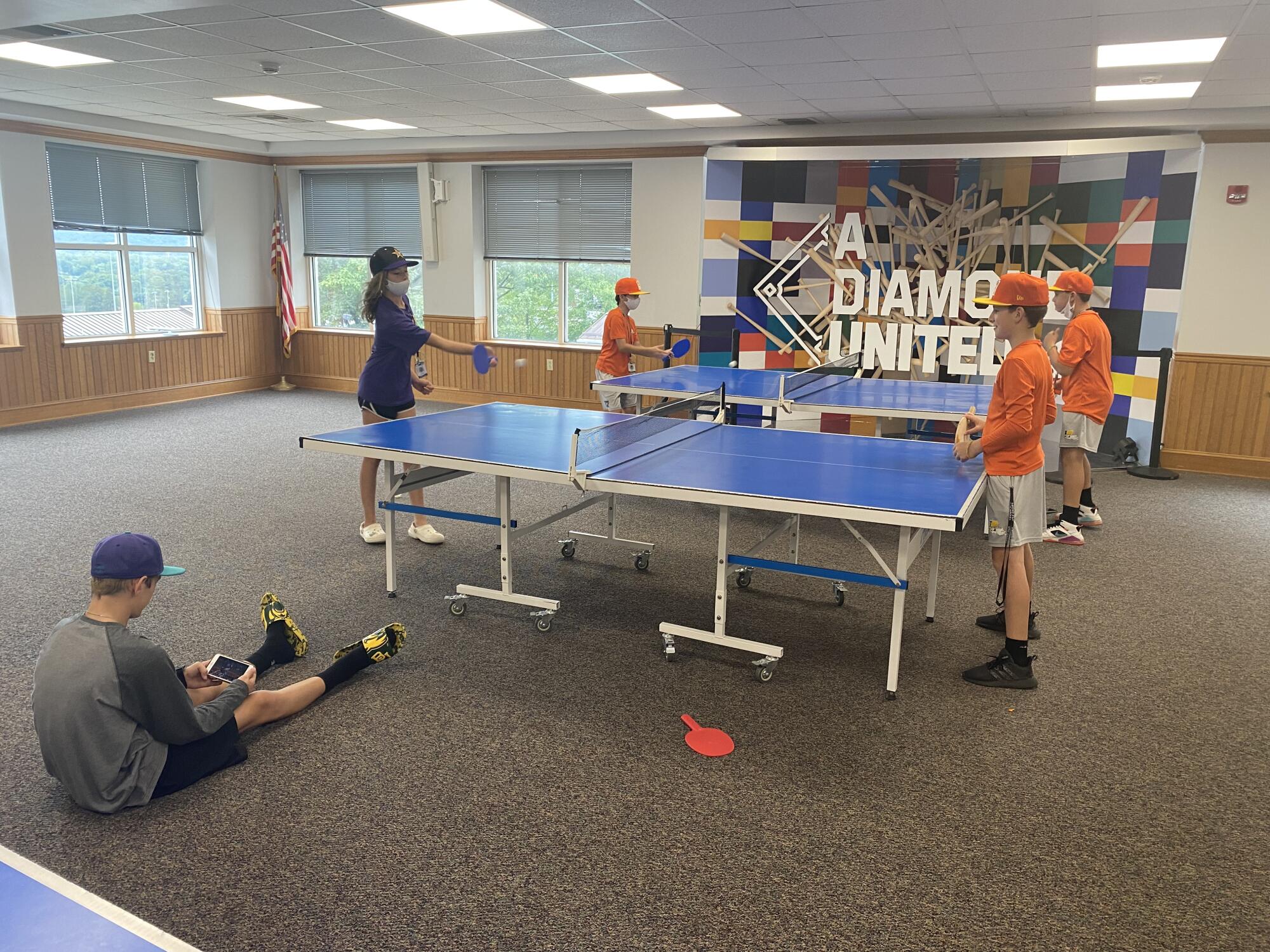 Ella Bruning plays pingpong against Lafayette Little League in Little League headquarters complex.