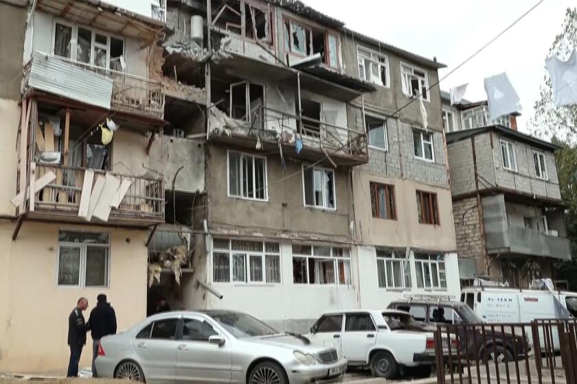In this photo taken from video and released by Official Twitter account of the Ministry of Foreign Affairs of the Artsakh Republic in the breakaway territory of Nagorno-Karabakh in Azerbaijan on Tuesday, Sept. 19, 2023, a damaged residential apartment building following shelling is seen in Stepanakert in the breakaway territory of Nagorno-Karabakh in Azerbaijan. Azerbaijan on Tuesday declared that it started what it called an "anti-terrorist operation" targeting Armenian military positions in the Nagorno-Karabakh region and officials in that region said there was heavy artillery firing around its capital. (Gegham Stepanyan, Ombudsman Human Rights of the Artsakh Republic in the breakaway territory of Nagorno-Karabakh in Azerbaijan in his Twitter account via AP)