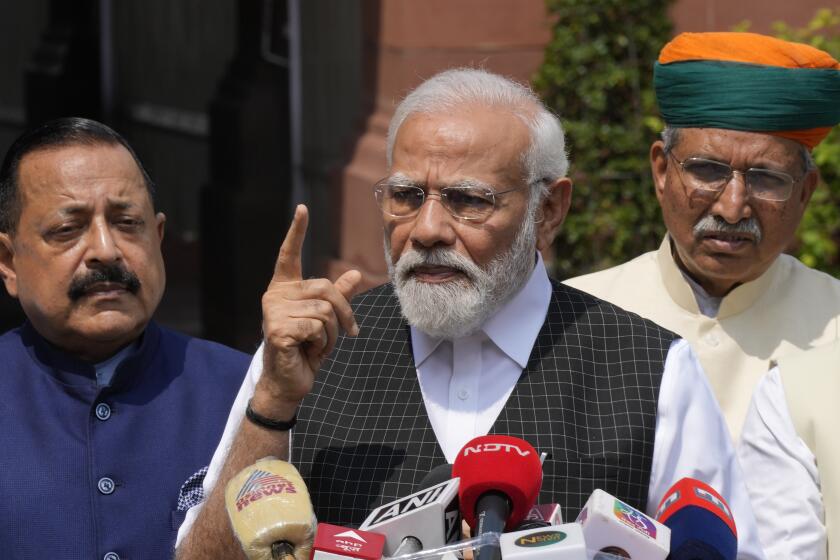 Indian Prime Minister Narendra Modi speaks as he arrives on the opening day of the monsoon session of the Indian parliament in New Delhi, India, Thursday, July 20, 2023. Modi Thursday broke more than two months of his public silence over the deadly ethnic clashes that have marred the country's remote northeast Manipur state, a day after a viral video showed two women being paraded naked by a mob, sparking outrage across the nation. (AP Photo/Manish Swarup)