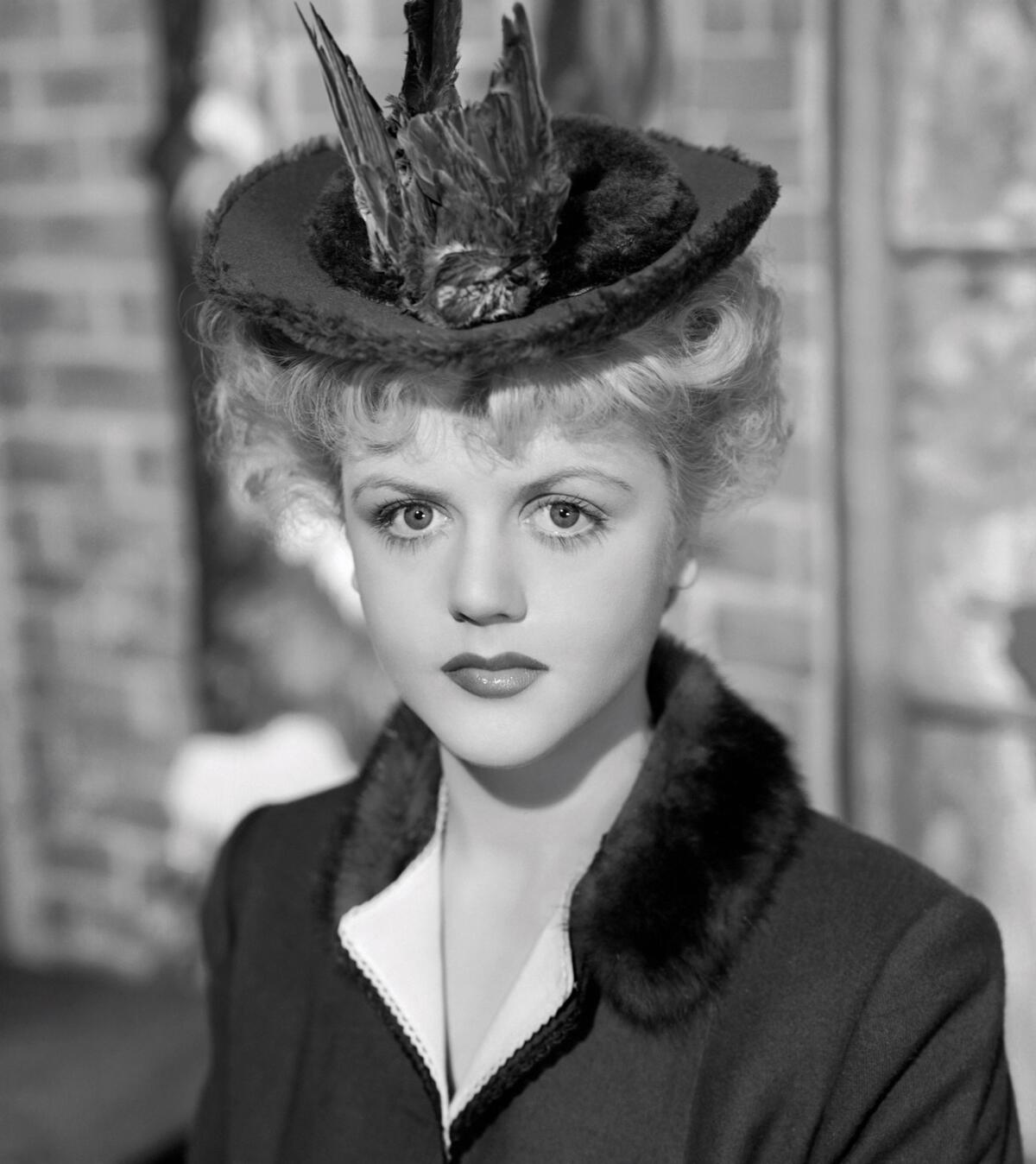 Angela Lansbury wearing a hat decorated with a dead bird in "The Picture of Dorian Gray" (1945)