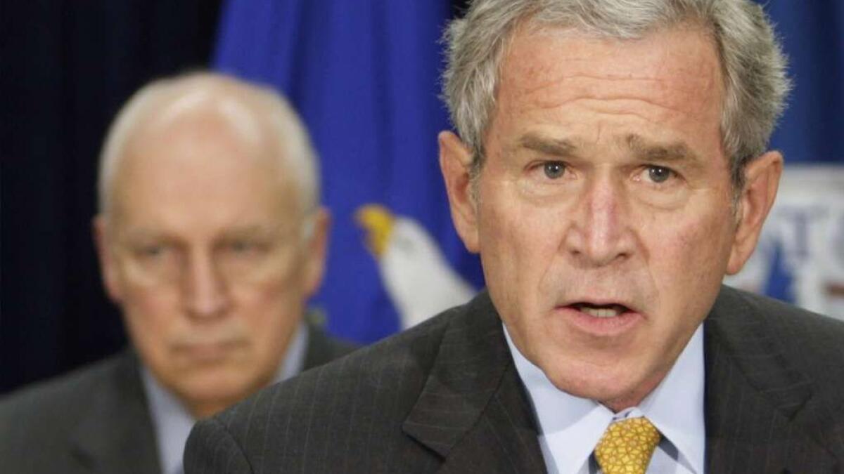 President George W. Bush delivers remarks on counterterrorism while Vice President Dick Cheney looks on at the J. Edgar Hoover FBI Building in 2007.