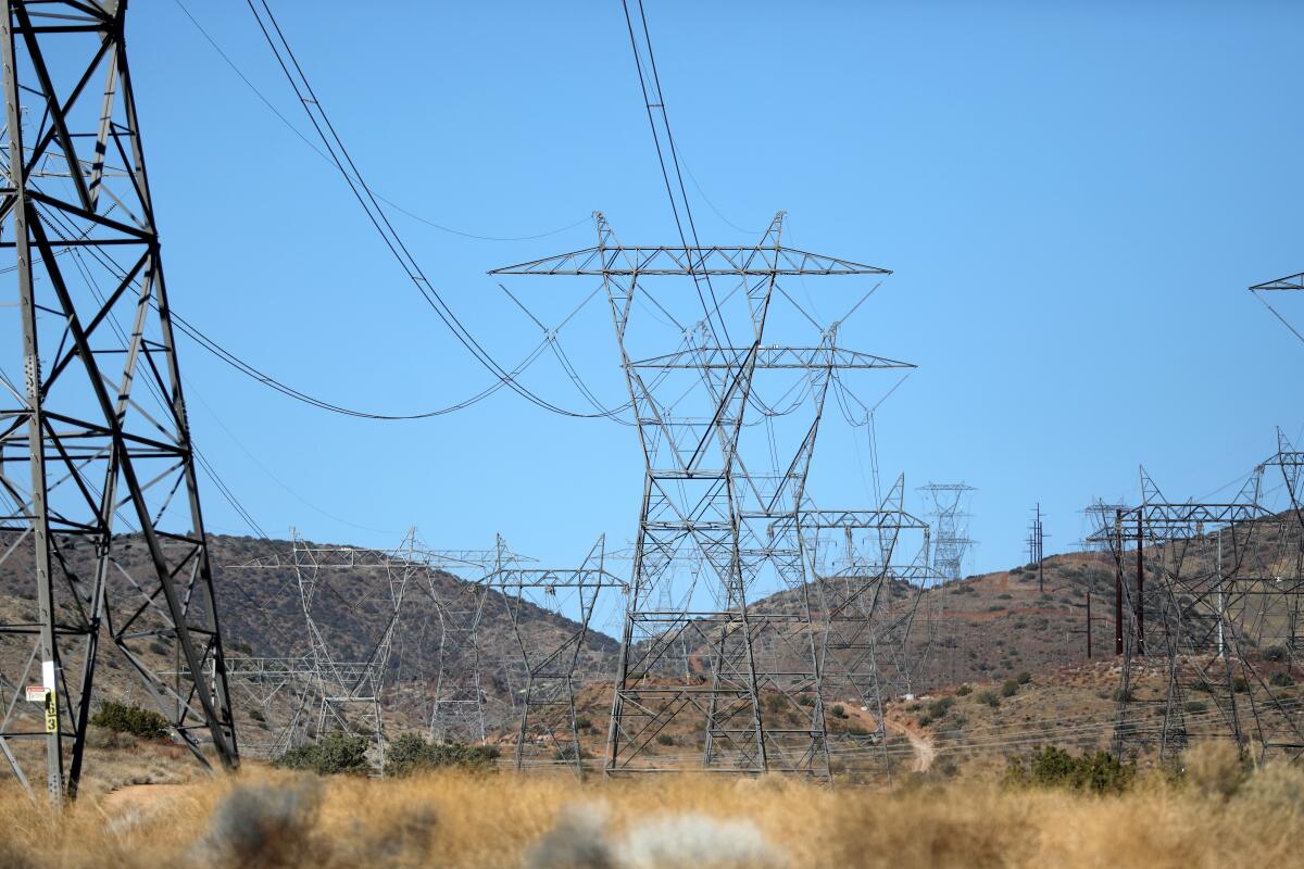 Electric transmission lines are seen along a power corridor near Palmdale in 2021.