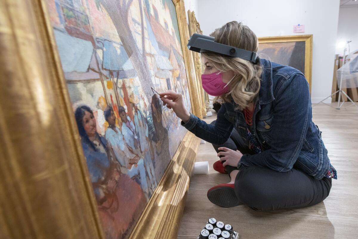 Morgan Wylder, an assistant conservator of paintings with the Balboa Art Conservation Center