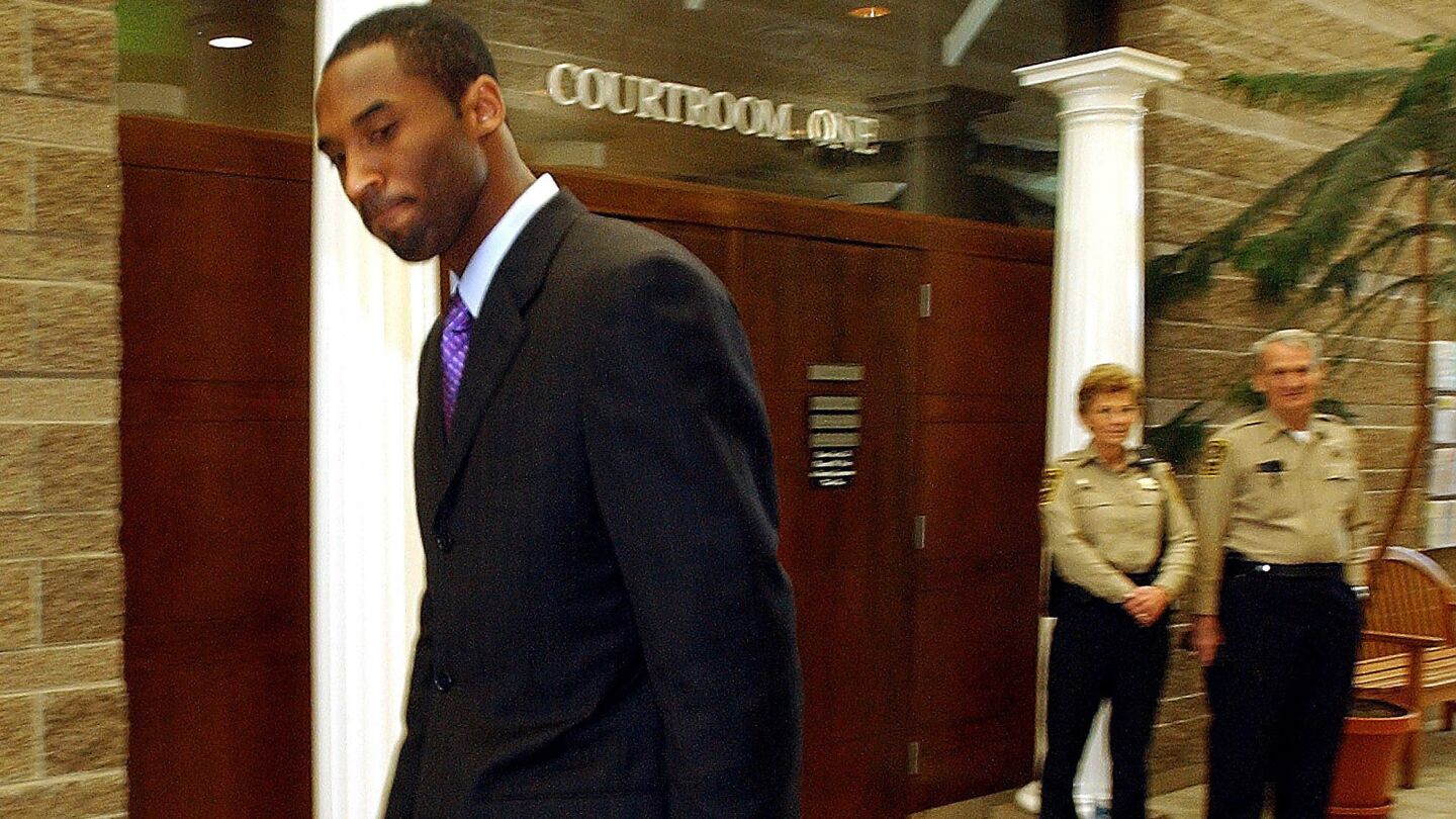Lakers guard Kobe Bryant walks past the courtroom where his pretrial motion hearing for sexual assault charges took place in Eagle, Colo., on March 25, 2004. In July 2003, Bryant was arrested after a woman claimed he raped her at a Colorado hotel. Prosecutors later dropped the charges.
