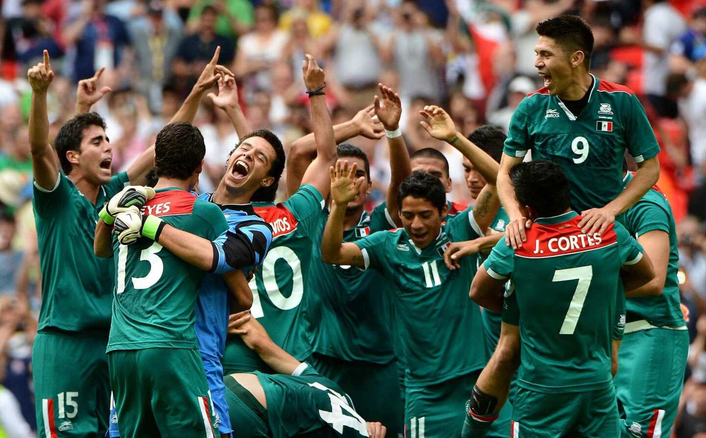 Mexico's soccer team celebrates a 2-1 Olympics final victory over Brazil. It was the first soccer gold medal for Mexico.