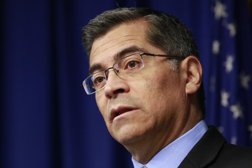 File - In this Feb. 20, 2018, file photo, California Attorney General Xavier Becerra discusses the need for bail reform, in Sacramento, Calif. Judges must consider suspects' ability to pay when they set bail amounts, Becerra said Tuesday, May 1, 2018, adding momentum to ongoing talks aimed at finding a better way to make sure suspects show up in court. Judges should only keep suspects in jail awaiting trial if they are dangerous or are likely to flee, Becerra said. (AP Photo/Rich Pedroncelli, File)