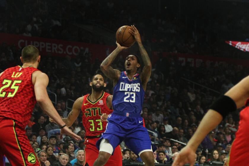 LOS ANGELES, CA - NOVEMBER 16, 2019: LA Clippers guard Lou Williams (23) pulls-up for a jumper in front of Atlanta Hawks center Alex Len (25) in the first half at Staples Center on November 16, 2019 in Los Angeles, California. (Gina Ferazzi/Los AngelesTimes)