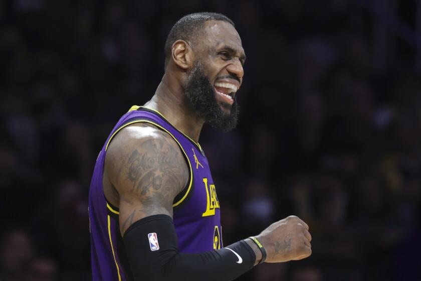Los Angeles Lakers forward LeBron James (23) celebrates during the second half.