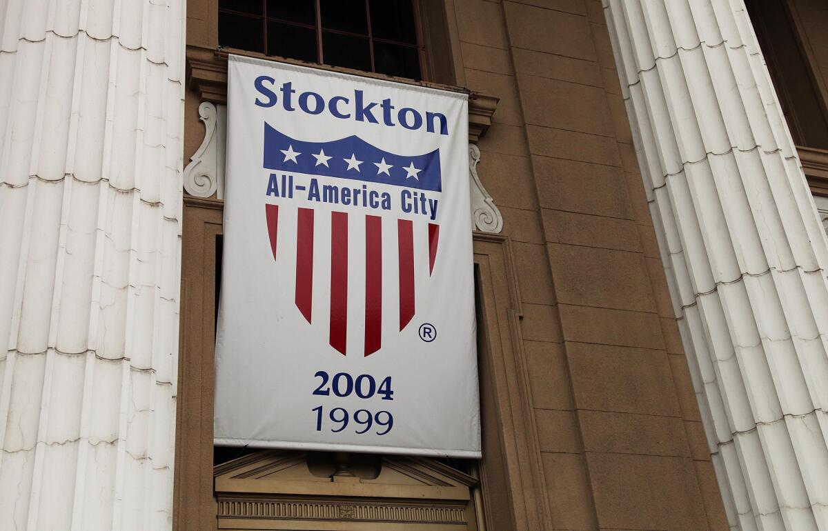 A banner proclaiming Stockton as an All-America city hangs from city hall in Stockton, Calif.