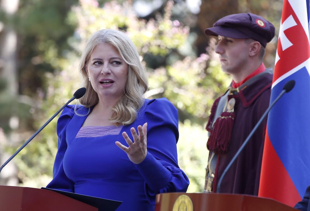 FILE - Slovakia's President Zuzana Caputova talks for the media during a news conference with North Macedonia's President Stevo Pendarovski at the presidential palace in Skopje, North Macedonia, on Wednesday, Sept. 7, 2022. Caputova swore in on Tuesday, Sept. 13, 2022, new ministers who replaced their predecessors from a junior coalition partner that withdrew from the governing four-party coalition, leaving Prime Minister Eduard Heger without a parliamentary majority. (AP Photo/Boris Grdanoski, File)