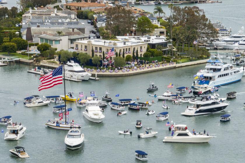 NEWPORT BEACH, CA - JUNE 08: Supporters turned out, even on boats, for Donald Trump's fundraising visit to Newport Beach hosted by Palmer Luckey and Kimberly and John Word on Saturday, June 8, 2024. (Myung J. Chun / Los Angeles Times)