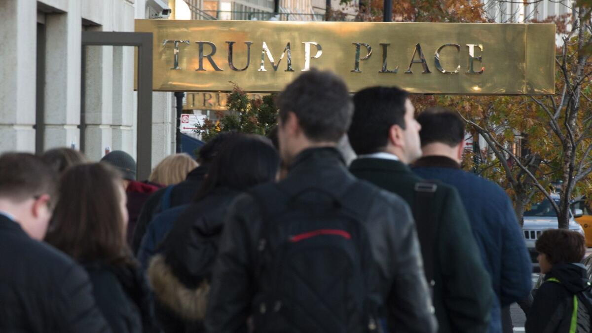 People stand in line outside a polling station at Trump Place in New York on Nov. 8, 2016.