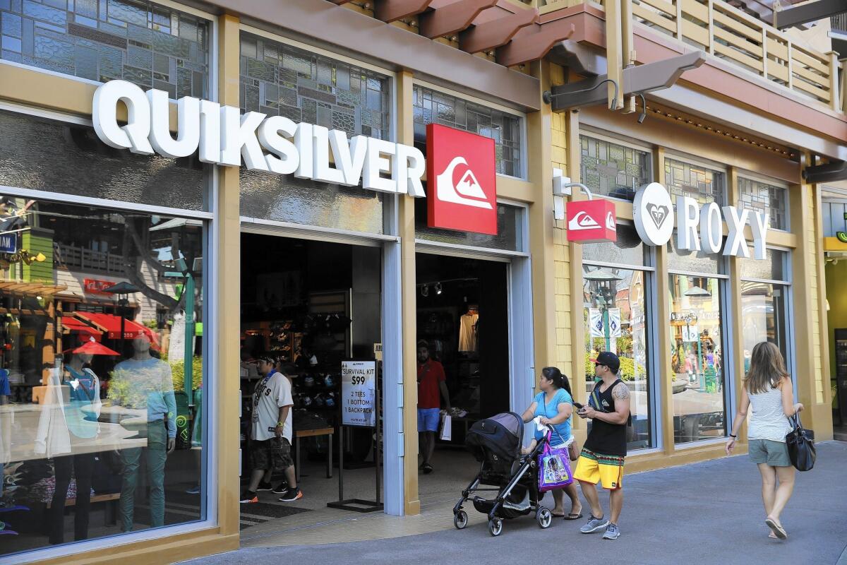 People stroll by the Quiksilver store at Downtown Disney in Anaheim on Wednesday The iconic surfwear company has filed for bankruptcy protection for its U.S. operations after struggling for years in a changing retail landscape. The Huntington Beach-based firm may close stores in Costa Mesa, Newport Beach and Irvine, among other places, according to court documents.