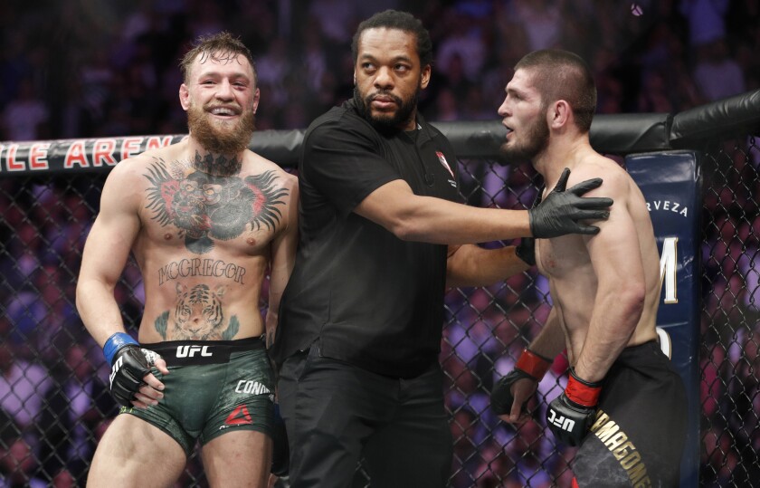 Conor McGregor, left, fights Khabib Nurmagomedov are separated during a UFC 229 mixed martial arts bout in Las Vegas. Nurmagomedov was fined $500,000 and suspended for nine months for a brawl inside and outside the octagon after his fight with Conor McGregor at UFC 229. McGregor was fined $50,000 and suspended for six months. The suspensions for both fighters are retroactive to Oct. 6.