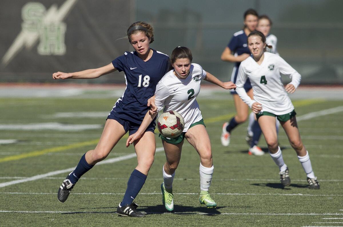 Sage Hill’s Alana Karro and Calvary Chapel’s Sophie Mckewon battle for a ball during a non-league game at Sage Hill on Saturday.