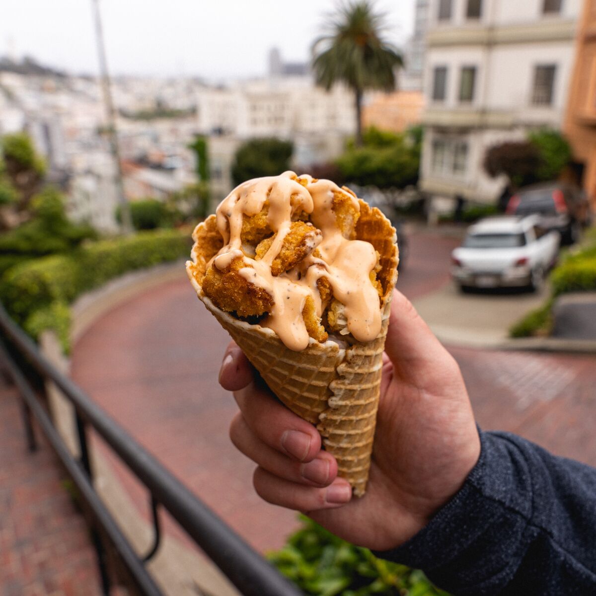 Chick'nCone is giving a free meal to the hungry for each one purchased, via the cellphone app GiftAMeal.