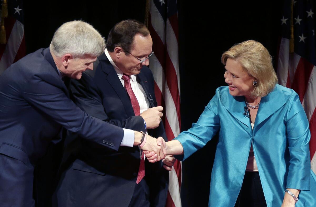 Sen. Mary Landrieu (D-La.) greets Republican Senate candidate Rep. Bill Cassidy, left, after their debate with Republican candidate Rob Maness, center, at Centenary College in Shreveport, La., on Oct. 14.