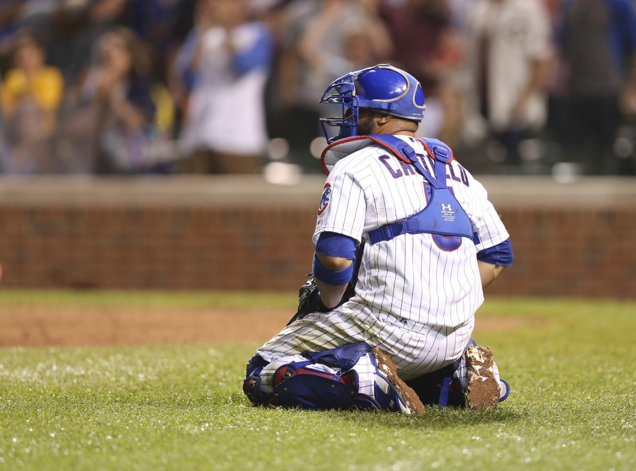 Cubs catcher Welington Castillo reacts after a run was scored by the Brewers' Aramis Ramirez during the ninth inning.