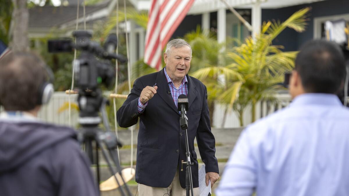 Rep. Dana Rohrabacher speaks Monday during a news conference outside his Costa Mesa home about jet noise affecting residents in his congressional district.