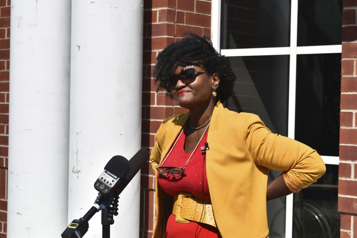 Adirondack Diversity Initiative Director Nicole Hylton-Patterson addresses the media during a news conference outside the Essex County Courthouse in Elizabethtown, N.Y., on Thursday, Aug. 6, 2020. Hylton-Patterson, who became the first-ever director of the Adirondack Diversity Initiative in December 2019, moved to the Adirondack Mountains to try to make this vast and overwhelmingly white region more welcoming to people like her. (Elizabeth Izzo/Adirondack Daily Enterprise via AP)
