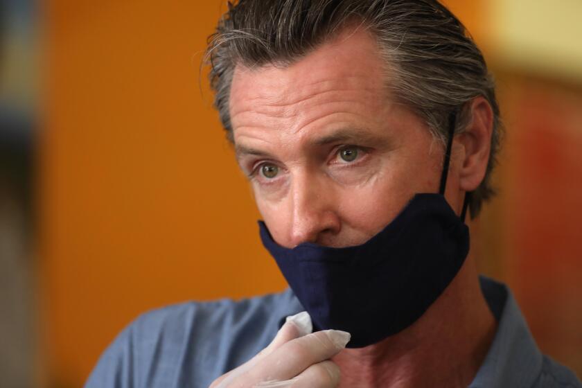 LOS ANGELES, CA - JUNE 03, 2020 - - California Governor Gavin Newsom is interviewed while visiting the Hot and Cool Cafe in Leimert Park after several days of protest in Los Angeles on June 3, 2020. (Genaro Molina / Los Angeles Times / POOL)