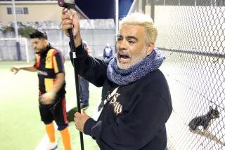 A man watches a soccer game