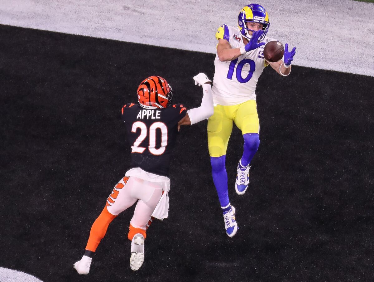 Rams receiver Cooper Kupp leaps to make a touchdown catch over Bengals cornerback Eli Apple.