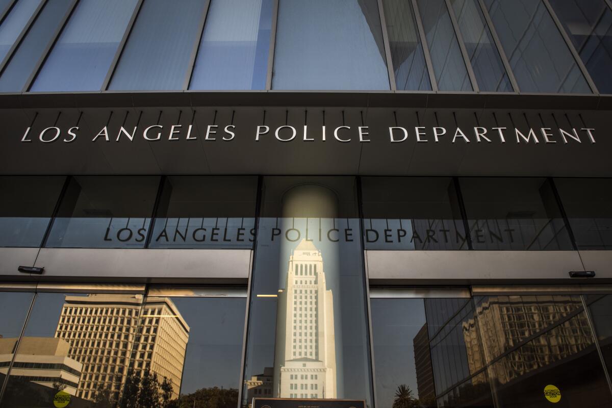 City Hall reflected on the doors of Los Angeles Police Department headquarters in downtown L.A.