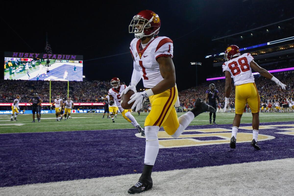 USC receiver Darreus Rogers scores a touchdown against Washington during the second quarter of a game on Saturday.