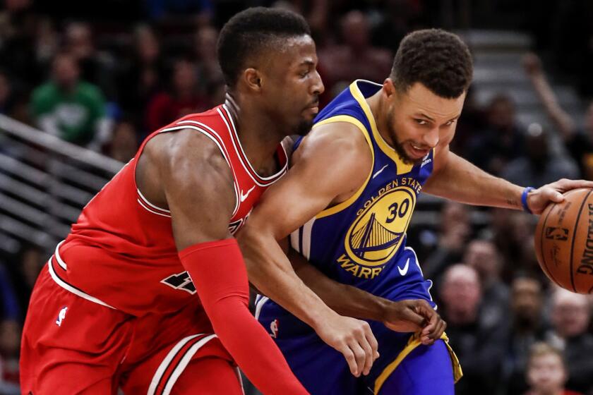 Mandatory Credit: Photo by TANNEN MAURY/EPA-EFE/REX/Shutterstock (9324804aq) Golden State Warriors guard Stephen Curry (R) tries to maneuver around Chicago Bulls guard David Nwaba (L) in the second half of their NBA game at the United Center in Chicago, Illinois, USA, 17 January 2018. The Warriors defeated the Bulls. Golden State Warriors at Chicago Bulls, USA - 17 Jan 2018 ** Usable by LA, CT and MoD ONLY **