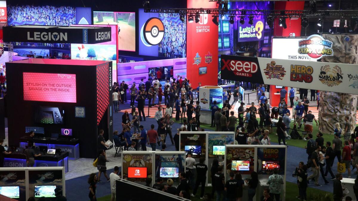 People attend the annual Electronic Entertainment Expo, E3, at the Los Angeles Convention Center.
