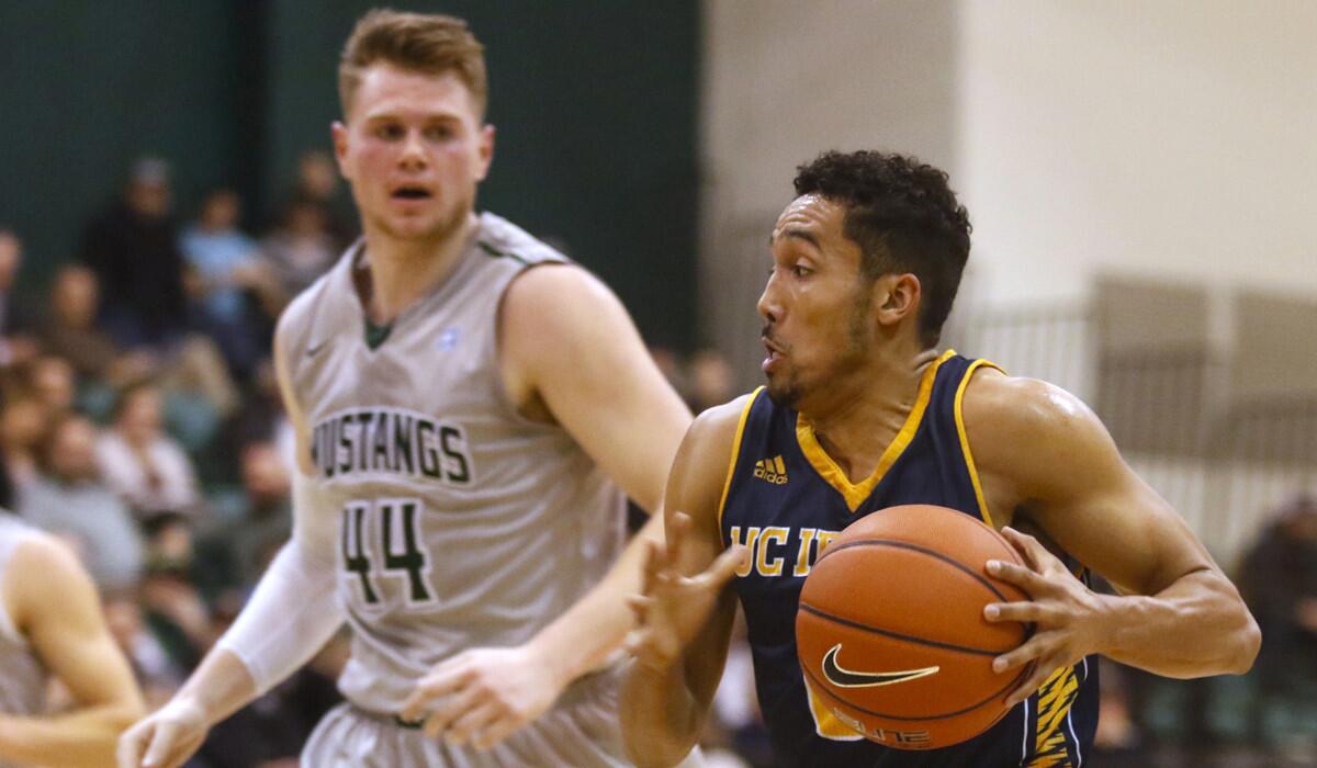 UC Irvine's Jaron Martin drives on a fast break against Cal Poly's Zach Gordon (44) during a game on Feb. 3.