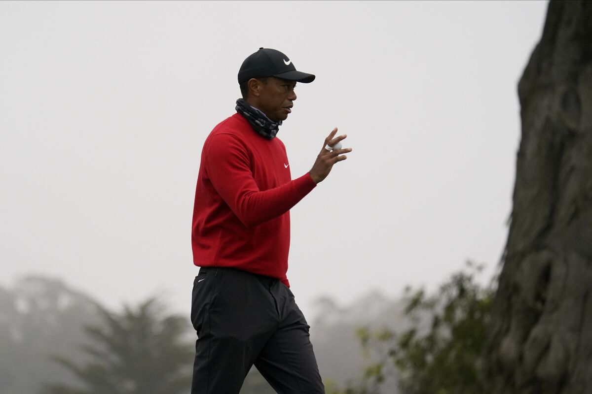 Tiger Woods waves on the 11th hole during the final round of the PGA Championship golf tournament at TPC Harding Park Sunday, Aug. 9, 2020, in San Francisco. (AP Photo/Jeff Chiu)