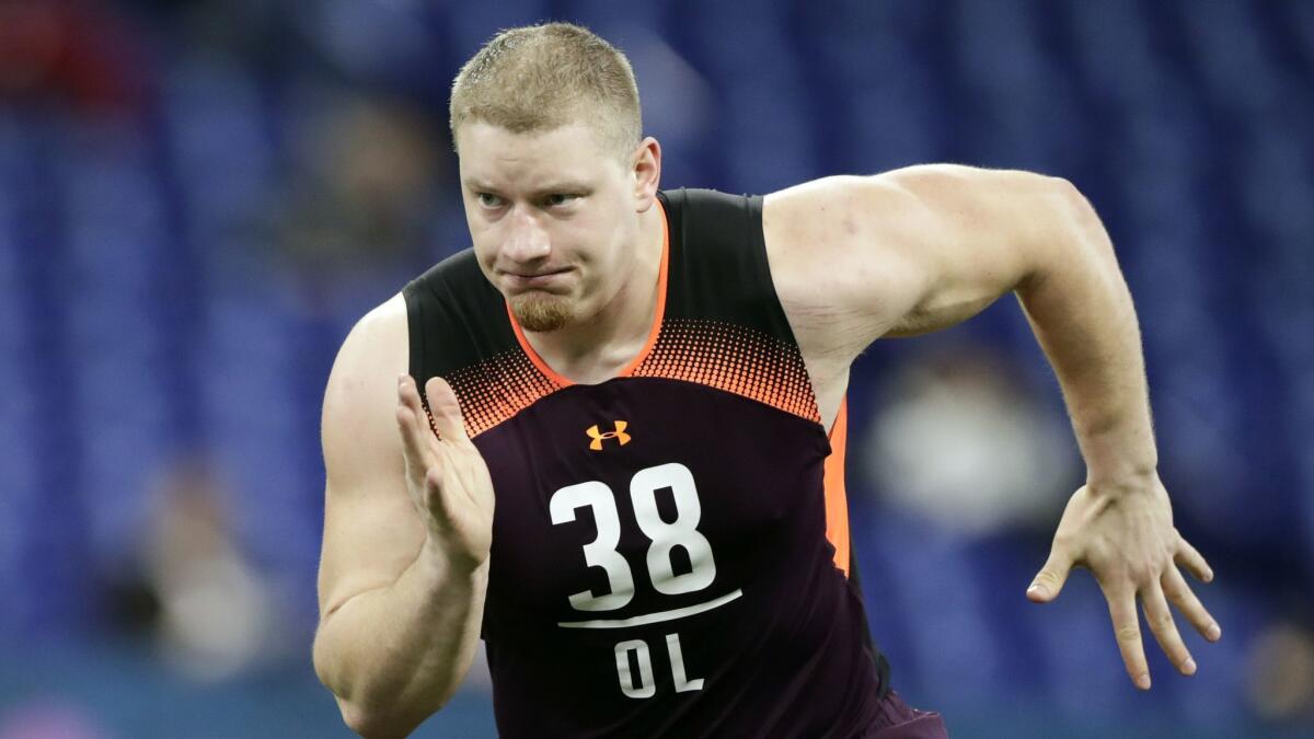 Washington offensive lineman Kaleb McGary runs a drill at the NFL scouting combine.