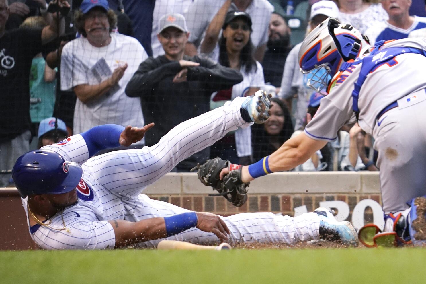 Nico Hoerner of the Chicago Cubs reacts after scoring a run in a