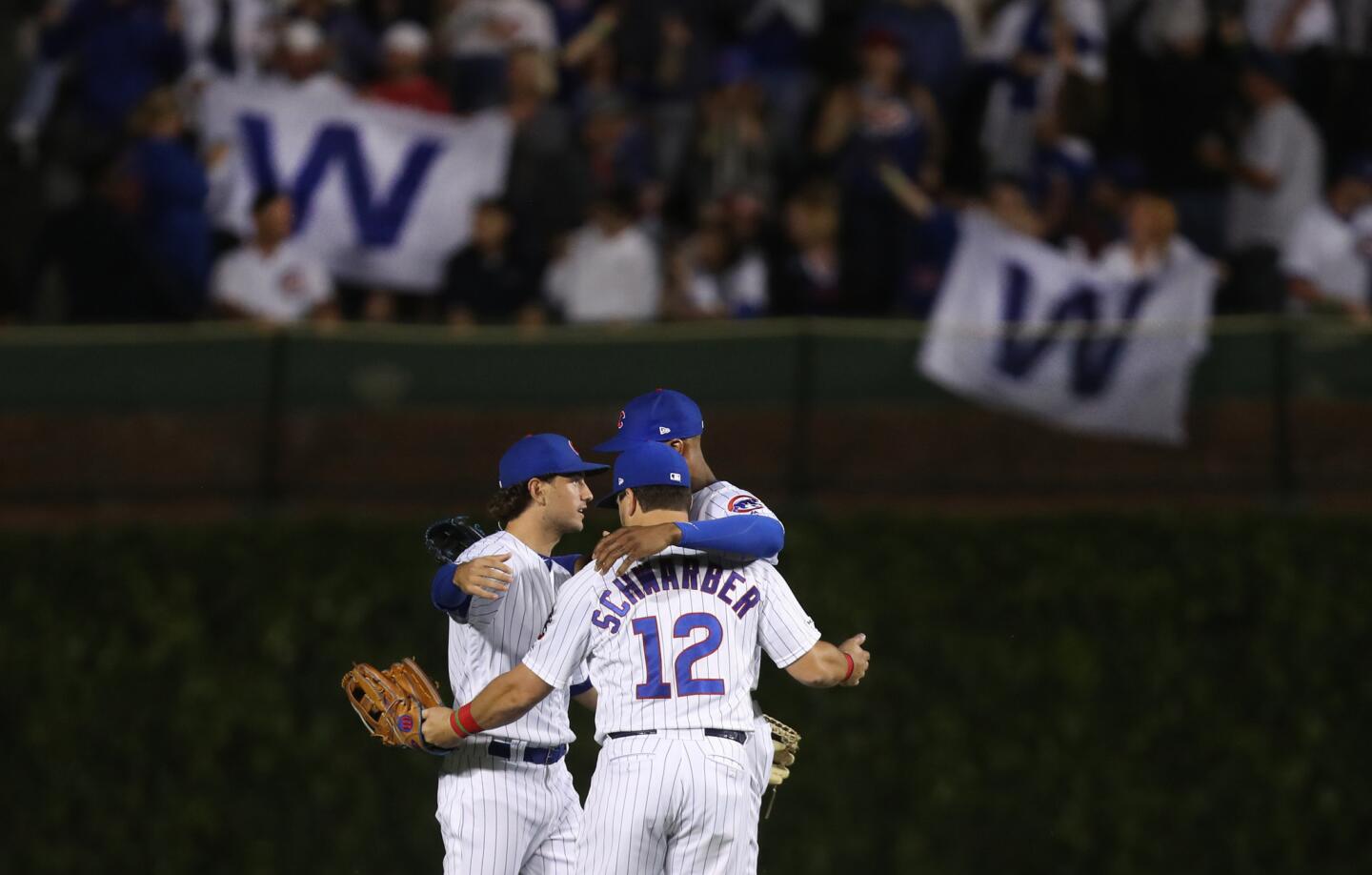 Chicago Cubs outfielders Albert Almora Jr., Kyle Schwarber (12), and Jason Heyward (right), celebrate after a victory over the St. Louis Cardinals at Wrigley Field in Chicago on Saturday, June 8, 2019. (Chris Sweda/Chicago Tribune)