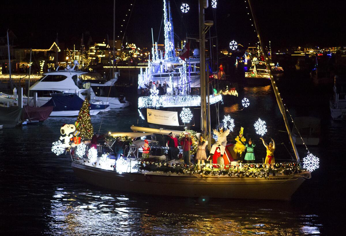 A group dressed as the "Peanuts" gang dances on a boat during a past Newport Beach Christmas Boat Parade. HGTV star Christina Anstead will be grand marshal of this year's parade in Newport Harbor.