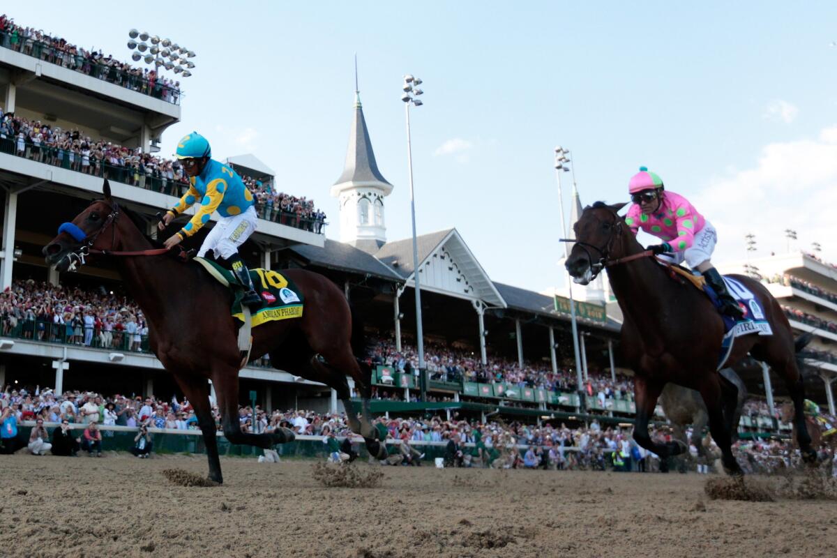 American Pharoah, with jockey Victor Espinoza aboard, wins the 141st Kentucky Derby by a length over Firing Line and jockey Gary Stevens.