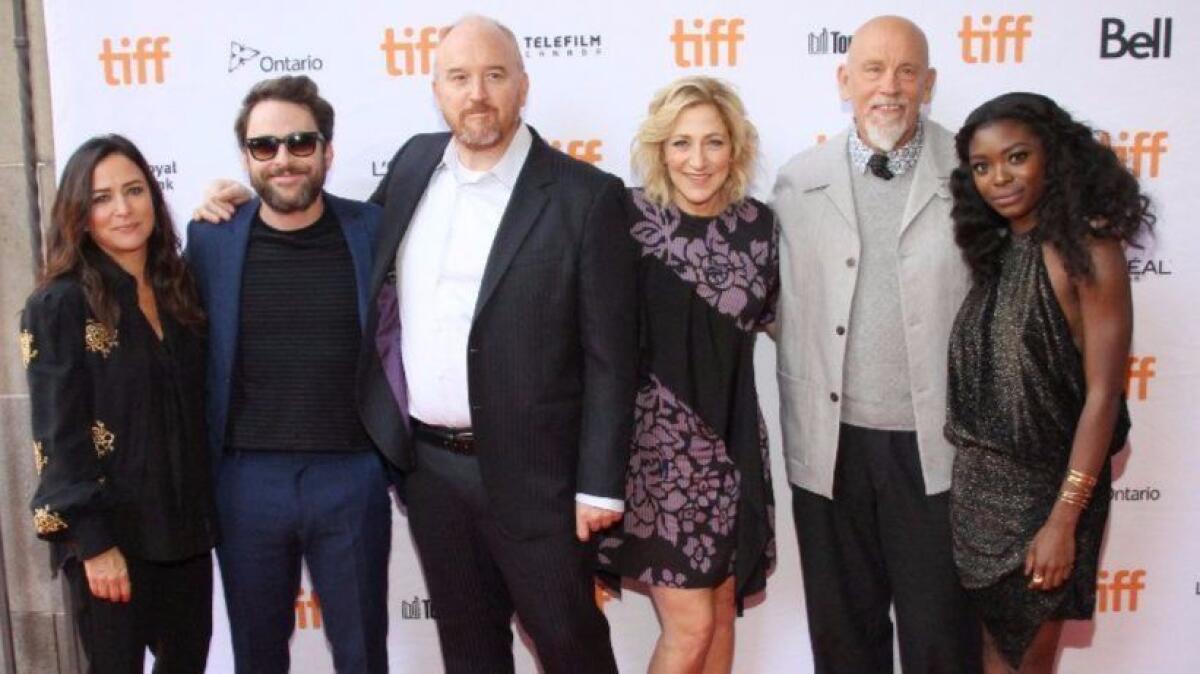 At the Toronto International Film Festival for the premiere of "I Love You Daddy" are, from left: Pamela Adlon, Charlie Day, Louis C.K., Edie Falco, John Malkovich and Ebonee Noel.