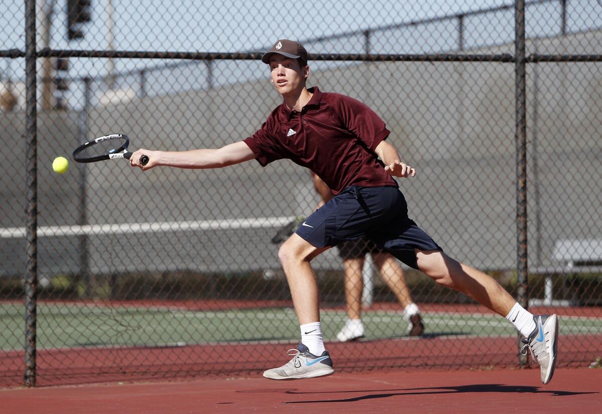Estancia High's Jake Hastings chases down the ball against Costa Mesa in a No. 1 singles set during an Orange Coast League match on Thursday.