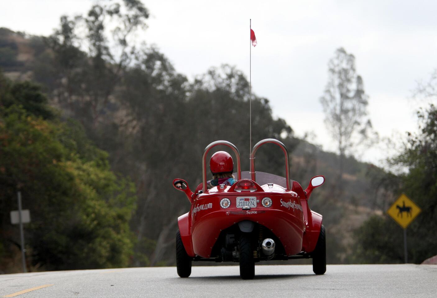 Company co-owner Amy Wagner drives along Griffith Park roads during a three-hour, Red Carpet tour offered by Burbank-based Sunnyday Scoot on Friday, June 5, 2015.