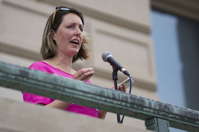 FILE - Dr. Caitlin Bernard, a reproductive health care provider, speaks during an abortion rights rally on June 25, 2022, at the Indiana Statehouse in Indianapolis. Bernard, who provided abortion drugs to a 10-year-old rape victim from Ohio, defended her actions before a judge Monday, Nov. 21, 2022, in an episode that drew national attention in the weeks after the U.S. Supreme Court overturned Roe v. Wade. (Jenna Watson/The Indianapolis Star via AP, File)
