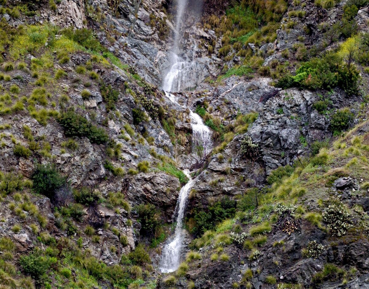 A waterfall on a mountainside.