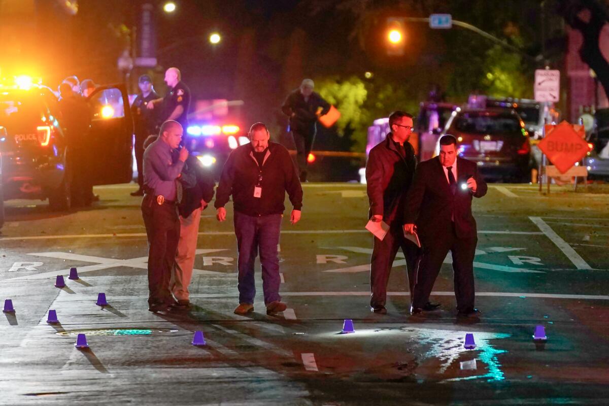 Authorities search the shooting scene in Sacramento. 